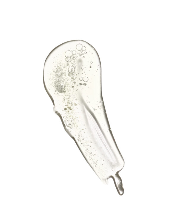 30138_restore_bionic_face_serum_formula.jpeg Produkt utsmetad mot vit bakrund.